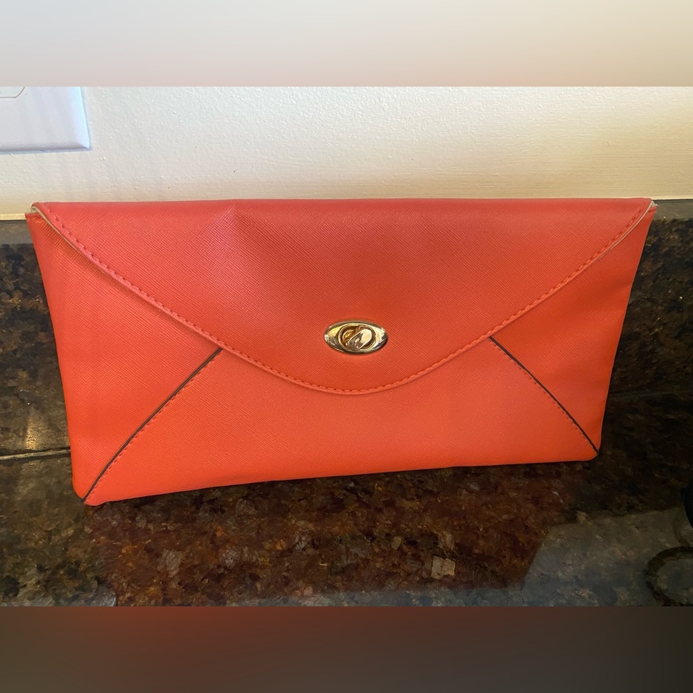 The Royal Standard Collection, coral colored clutch. Like new-only used once.